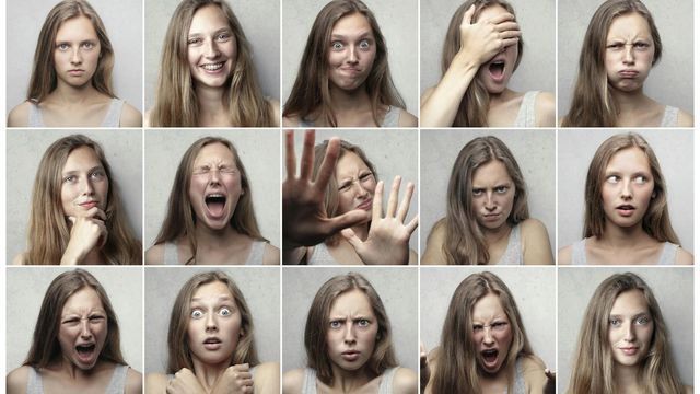 A woman displaying fifteen different emotions across panels 